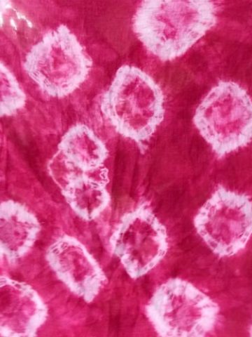 image of a red towel with pink circled dyed into it