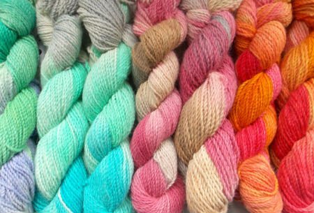 image of many skeins of yarn dyed multiple colors