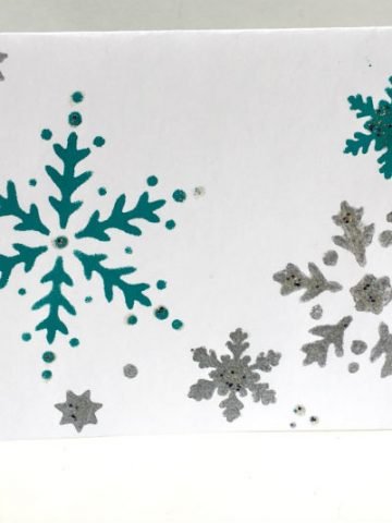 Card Stock Paper stenciled with Snow Flakes for a Handmade Christmas Card