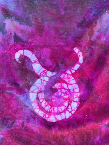 pink and purple fabric with a taurus symbol in white